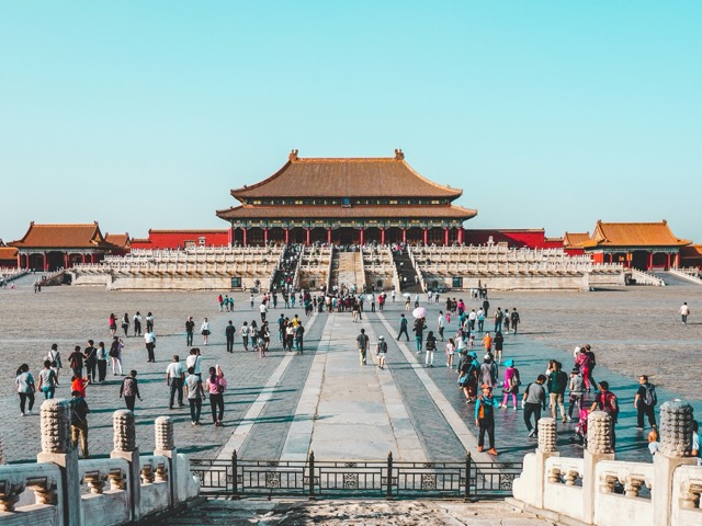 Visitors crossing the open square before the Forbidden City in Beijing